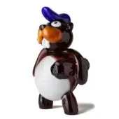 Glass beaver sculpture, dark brown and white, stylized form with orange nose and blue cylindrical crest atop head.