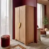 Distinguished Sicis Don Giovanni wardrobe crafted in light tan leather with gold metallic handles and sleek metal lacquer