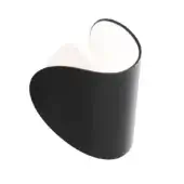Wall lamp, dark grey metal, asymmetrical curved shade with black exterior and white interior panel, mounted on off-white rectangular base.