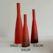 Red ceramic vases labeled “SOLO,” “SOLOP,” and “SOLOM” arranged on white, varying in height and tapered form against a gray backdrop.