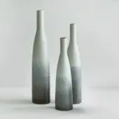 Distinguished Rina Menardi Bottiglie vase set in light gray-green baked clay with charcoal gradient and smooth matte finish