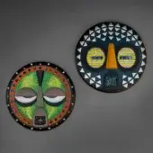Captivating Sicis Mask Capsule Collection mask with navy blue background and vibrant yellow mosaic face crafted in natural wood and Vetrite glass