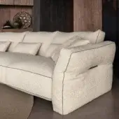 Superior Cierre1972 Loden sectional upholstered in textured creamy beige bouclé fabric with sophisticated leather piping