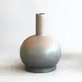Ceramic vase with rounded body, striated beige and gray finish, slender neck, flat base, and matte texture, studio lighting.