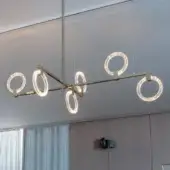 Elegant Sicis Polo suspension lamp crafted in metal with transparent methacrylate rings and brushed gold finish