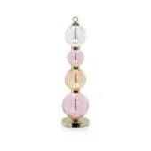 Table lamp, glass shades, pastel pink and peach tones, gold metal rods and base, swirling ribbed texture, vertical arrangement.