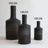 Ceramic vessels, dark matte finish, wood-grain texture; OBLMA is largest, OBLGR mid-size, OBLME smallest, each with textured openings.
