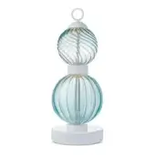 Table lamp, turquoise glass, stacked spherical globes with ribbing and swirling patterns, white metal rod, circular base, studio shot.