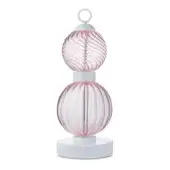 Table lamp, pink glass, stacked spherical globes with ribbed and swirling textures, white cylindrical stem, circular base, minimalist design.