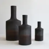 Exceptional Rina Menardi Oblo’ vase set handcrafted in baked clay with a gradient from dark to reddish-brown and a matte finish