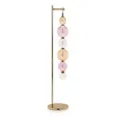 Floor lamp, brushed gold metal, with six hand-blown glass orbs in pink, peach, and amber hues arranged vertically along the slender stem.