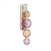 Wall sconce, brass and glass, features three stacked spherical shades in lavender-purple and amber-orange with a brushed metallic mounting plate.