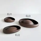 Ceramic bowls, dark brown, matte finish, varying sizes ELI1-ELI3, rounded organic shape, light gray background, studio product shot.