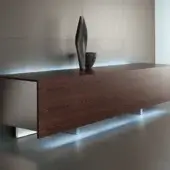 Elegant Acerbis Ludwig sideboard with reddish-brown wood, white lacquered interior and illuminated metallic side panels