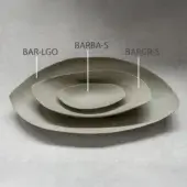 Olive-green ceramic dishes—large asymmetrical oval, medium rounded, small bowl—arranged concentrically on textured light gray concrete, labeled with white lines.