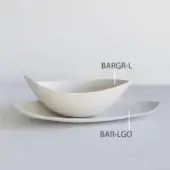 Ceramic serving bowl and platter, matte off-white, asymmetrical boat shape and rectangular form, minimalist tableware set.