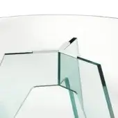 Glass circular table with green tint, featuring geometric glass panel base and chrome metal connectors, studio lit white background.