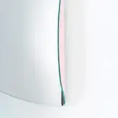 Curved mirror, turquoise and pink, with silver rim and layered edge design against a white backdrop, reflecting diffused light.