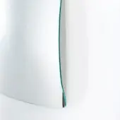 Irregular mirror, silver toned with turquoise border, curved reflective surface against a white backdrop, minimalist design, diffused lighting.
