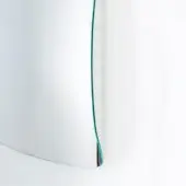 Open booklet with thick, glossy pages and a narrow teal spine against a white background, displaying a curved, reflective surface.