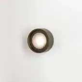 Berlin out wall light, anodic bronze, circular design with textured diamond inner and warm white illumination.