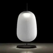 Floor lamp, frosted glass, elongated oval shade with vertical rulings, matte black stem and base, minimalist design, diffused light.