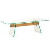 Dining table, brushed oak and clear glass, with triangular legs and a rectangular glass top, studio shot.