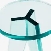 Round glass table with transparent tempered glass top and Y-shaped clear glass base, modern minimalist design, studio lighting.