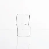 Glass vase, transparent, asymmetrical design with cylindrical base and curved indentation, studio shot on white glossy surface.