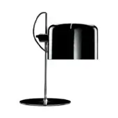 Black table lamp with cylindrical shade, chrome curved arm, and circular base, studio shot on white background.