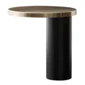 Cylindrical side table, matte black and satin gold, featuring a circular tabletop with a polished reflective surface and a smooth base.