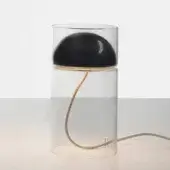 Table lamp, black and gold, with clear glass cylindrical base and black half-sphere shade, featuring a coiled light-brown cord.