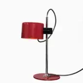 Table lamp, scarlet red, cylindrical shade with chrome stem and adjustable arm, glossy finish, circular base with chrome ring, black power cord.