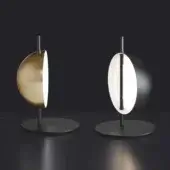 Distinguished Oluce Superluna lamp with a warm gold semi-spherical reflector and slender dark metal rod in a satin finish