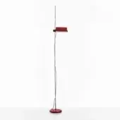 Floor lamp, scarlet red and chromium, with cylindrical ribbed shade and slender stem, on white surface against a white backdrop.