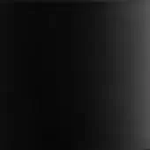 Matte black surface displaying tonal variations, exhibiting a uniform dark color and smooth, non-reflective texture with diffuse lighting.