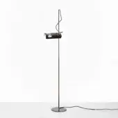 Black floor lamp with cylindrical metal stem, rectangular head, and curved reflective shade, studio shot on white background.