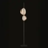 Floor lamp, satin brass and black, with two oval shades and slender stem, minimalist design, studio shot on black background.