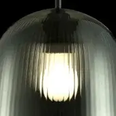 Pendant light, green glass, fluted shade; translucent material with gradient, white diffuser, dark gray metal fitting, studio lighting.