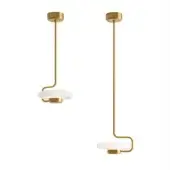 Tratto suspension lamps, brass finish, curved stems with matte white disc shades, studio lighting, coordinated pair with varied stem designs.