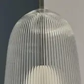 Glass pendant lamp, clear ribbed shade, brushed nickel fitting, Edison bulb visible, teal and gray backdrop, studio lighting.