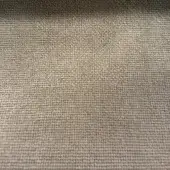 Taupe woven fabric texture with a consistent, even weave and subtle raised surface, displaying a muted warm gray tone under diffused lighting.