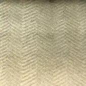 Herringbone fabric texture in muted beige, displaying a dense, diagonal weave with a matte finish and a small dark spot.