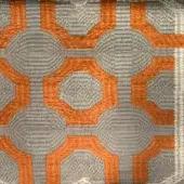 Geometric textile sample with gray and orange circular and hexagonal patterns on a beige background, featuring textured rope-like gray areas.