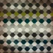 Hexagonal textile pattern in gray, teal, and olive green tones arranged in a diamond grid with a horizontal gradient and woven texture.