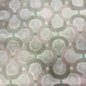 Pale pink textile with repeating off-white teardrop shapes and muted green lines in a grid pattern, featuring a textured woven surface.