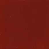 Red textured surface with mottled pattern, granular quality, and subtle tonal shifts; displays faint linear scratches and diffuse lighting.