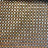 Woven textile sample with gray, golden-brown, and beige grid pattern; coarse texture, matte finish, and neutral earthy tone; labeled "co1007 col."