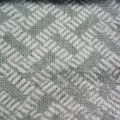 Herringbone textile sample with angled lines in sage green and off-white, featuring a plain weave and nubby texture; labeled "co1008 col.".