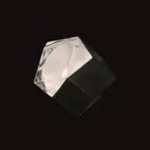 Geometric sculpture, black acrylic and resin, faceted angular form on rectangular prism base, studio lighting, high contrast.